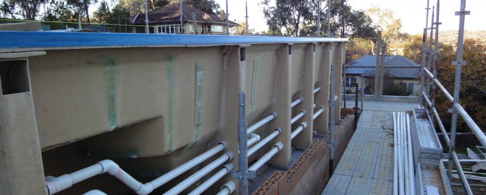 Above ground fibreglass pool installation with plumbing