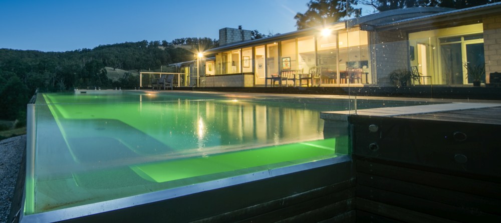 Above ground fibreglass pool with glass wall