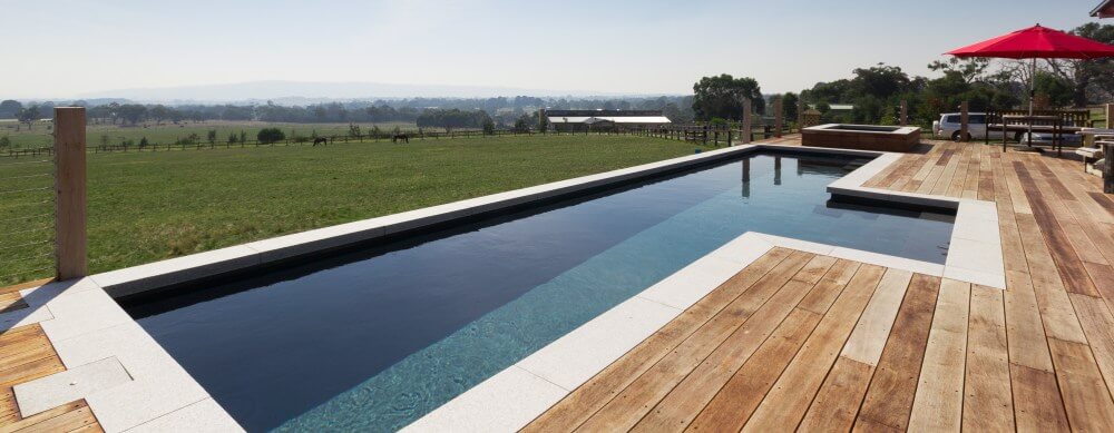 Fibreglass lap pool Fastlane built partially above the ground