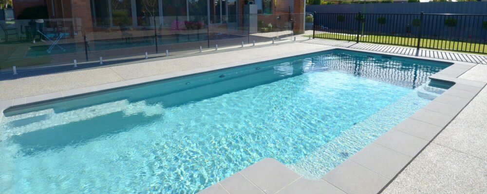 Glass fencing around the swimming pool